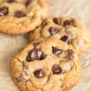 Close-up of fresh milled flour chocolate chip cookies with gooey chocolate chips and golden edges.