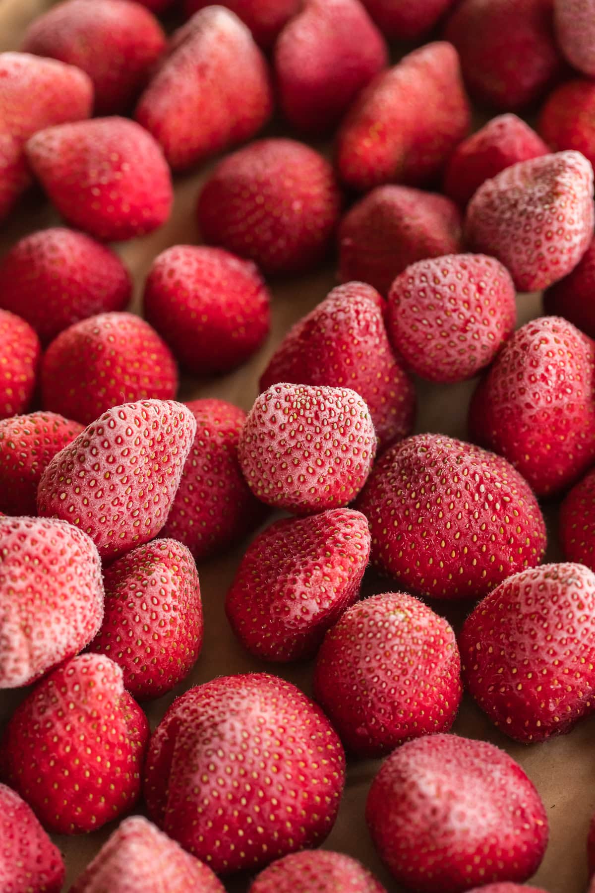how to freeze strawberries, frozen strawberries on sheet pan.