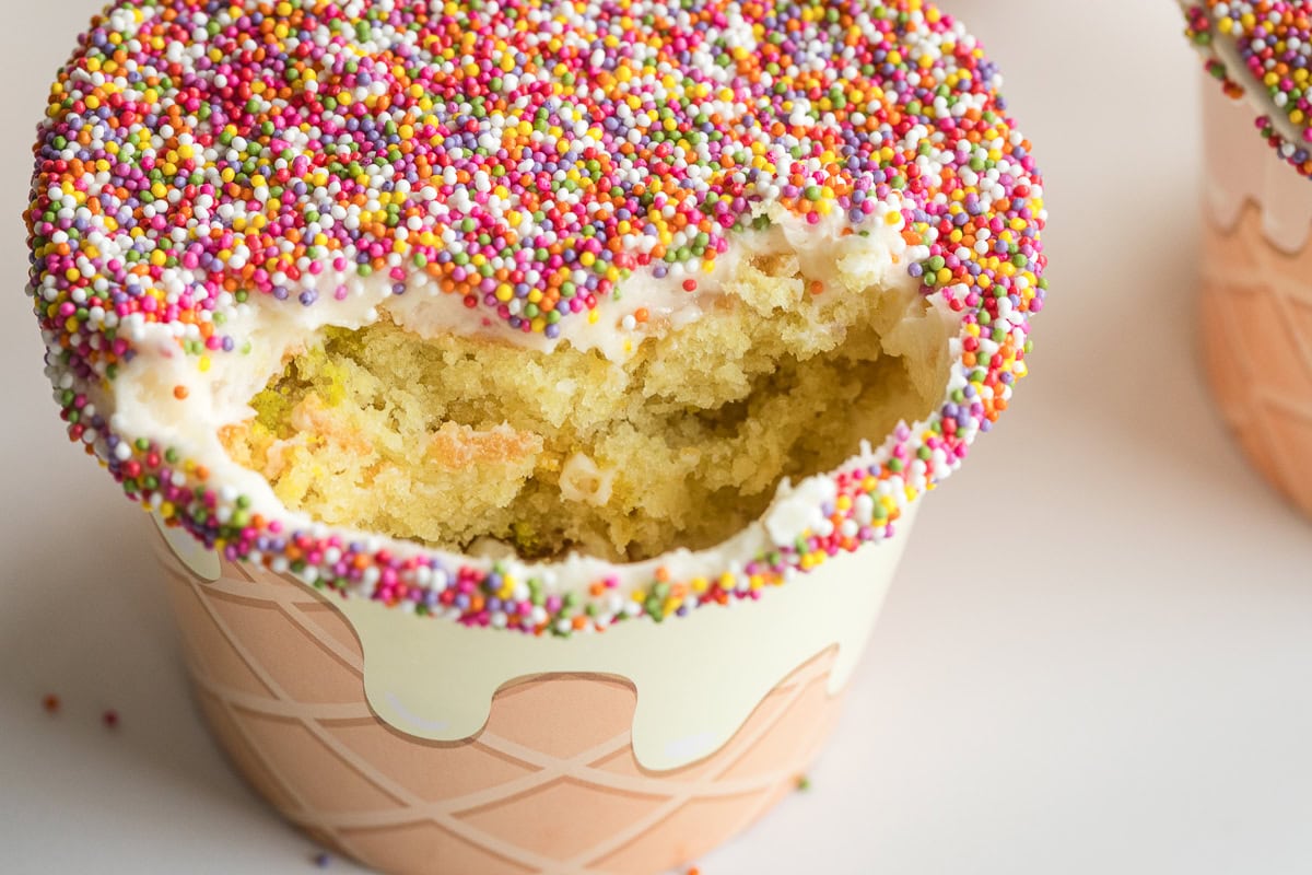 inside of cake layers with buttercream and nonpareil sprinkles.