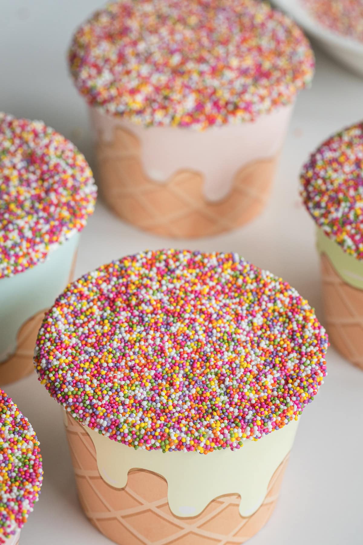 sprinkle cakes like viral dot cakes in snack cups.