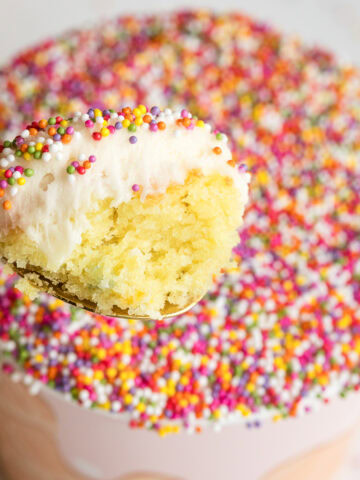 viral sprinkle cake cups like dot cakes with nonpareils spoonful showing a bite from inside.