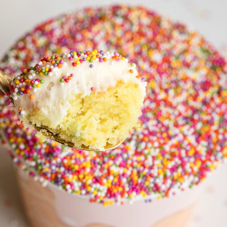 viral sprinkle cake cups like dot cakes with nonpareils spoonful showing a bite from inside.