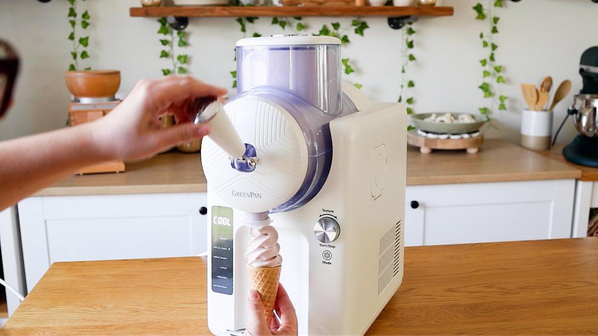 dispensing ice cream into cone from greenpan frost.