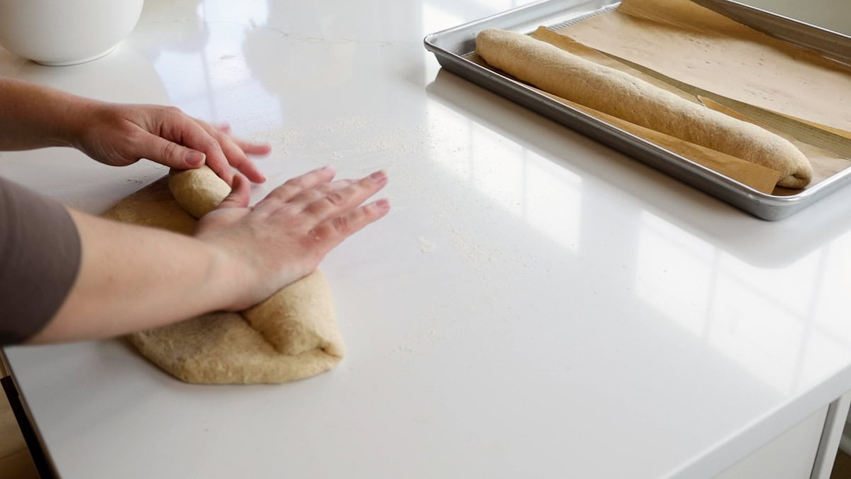 hand rolling dough.