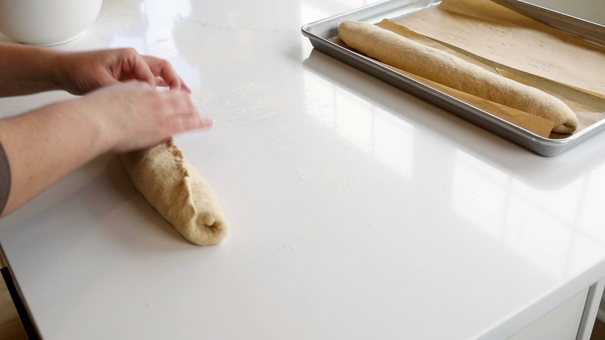 hands sealing dough.