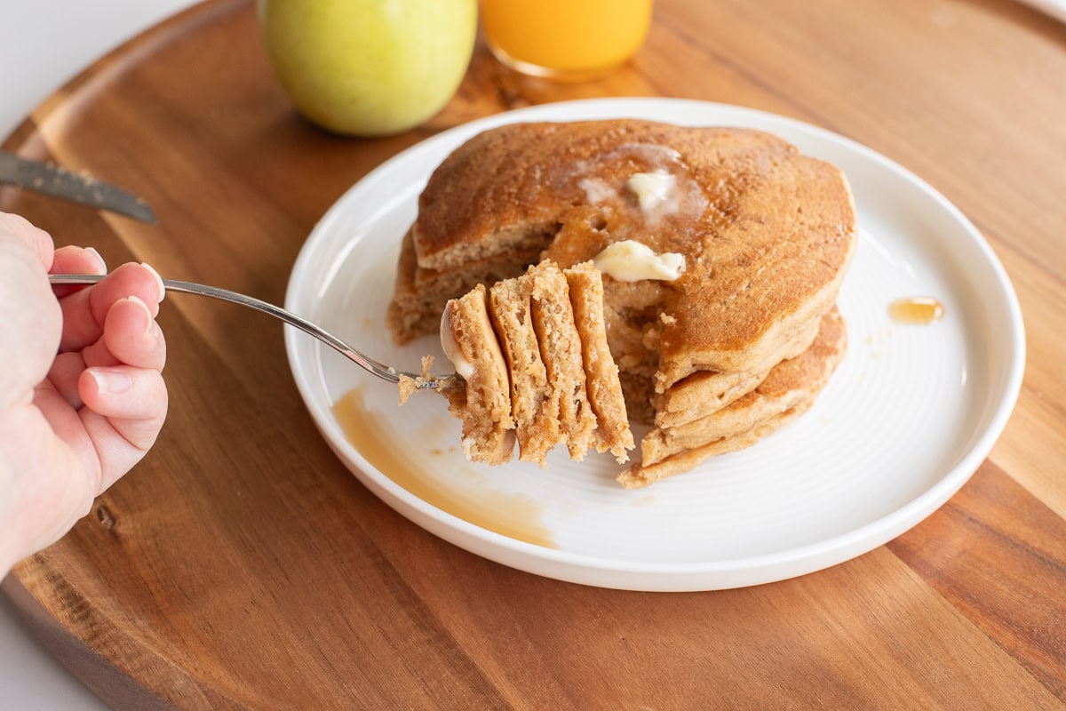 fork holding bite of einkorn pancakes.